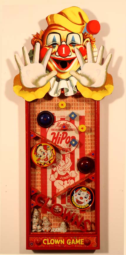     \"Clown Game\"
mixed-media assemblage
    38.5\" x 16\" x 3.25\"
    2007

    SOLD

    This piece has wood balls in the bottom drawer. You insert a ball in the clowns mouth and it rings a series of bells as it descends and ends up back in the drawer. 