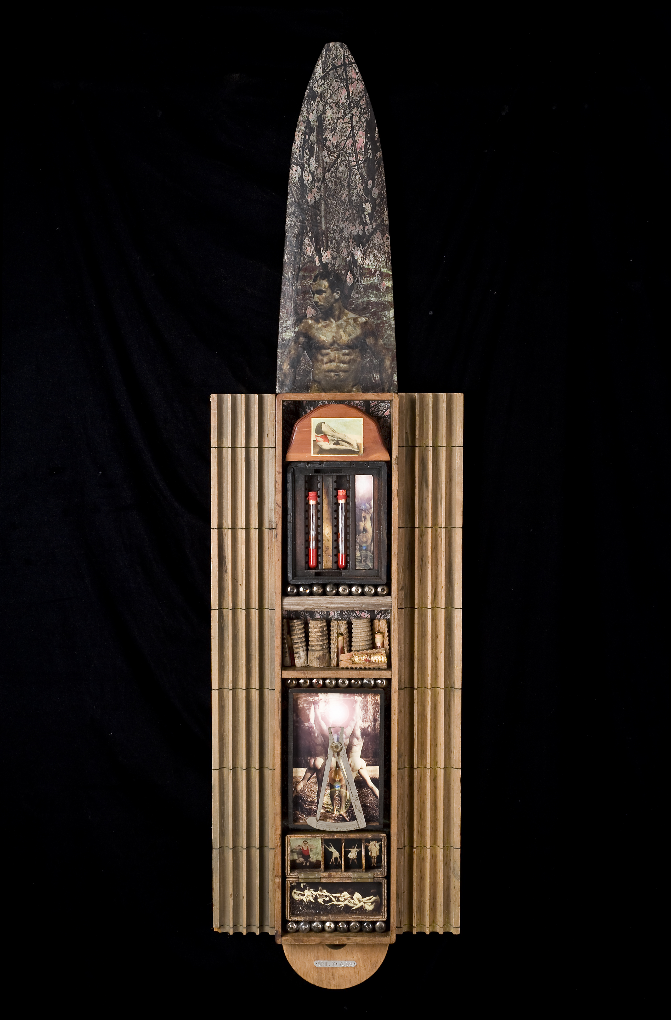     \"The Body Electric\"
    mixed-media assemblage
    53\"h x 14\"w x 2.5\"d
    2009

    $850.00

    Mixed-media assemblage with found wood boxes, wood crayon molds, wood pelt stretcher, foundry pattern, electronic glass tubes, digitals scans on paper from my collection of old photos, wax, wood telephone pole toppers, test tubes, small glass cordial, metal optometrist\'s measure, tobac card, gold leaf